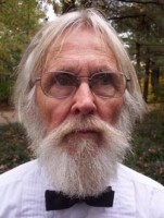 Philip Fontaine Older man with glasses and white hair, beard and mustache